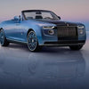 Luxury convertible car on reflective surface showcasing sleek design and craftsmanship, essential for car body maintenance tips.
